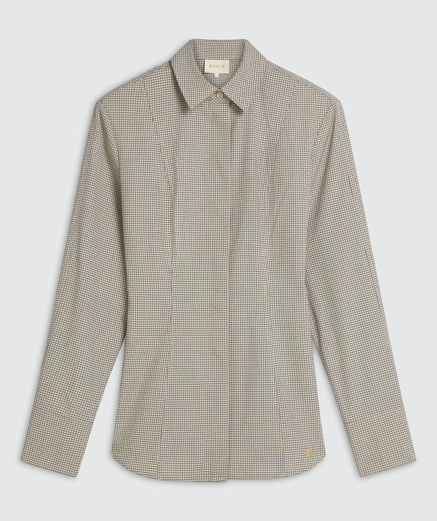 Een fitted blouse met schoudervullingen in het Stone Check-patroon, weergegeven op een lichtgrijze achtergrond