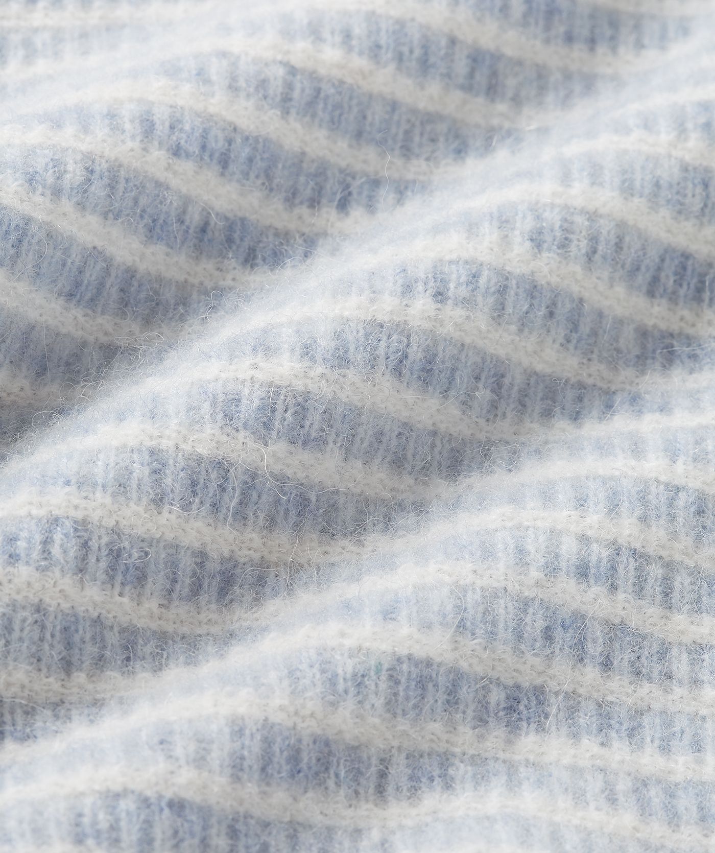 Close-up van de lichtblauw met wit gestreepte stof.