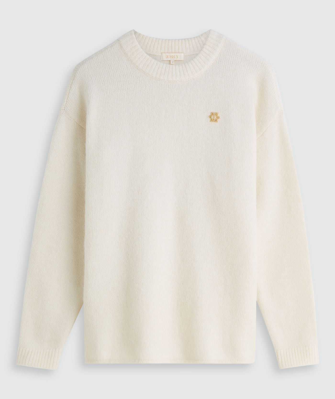 Oversized gebroken witte trui zonder model, weergegeven op een lichtgrijze achtergrond