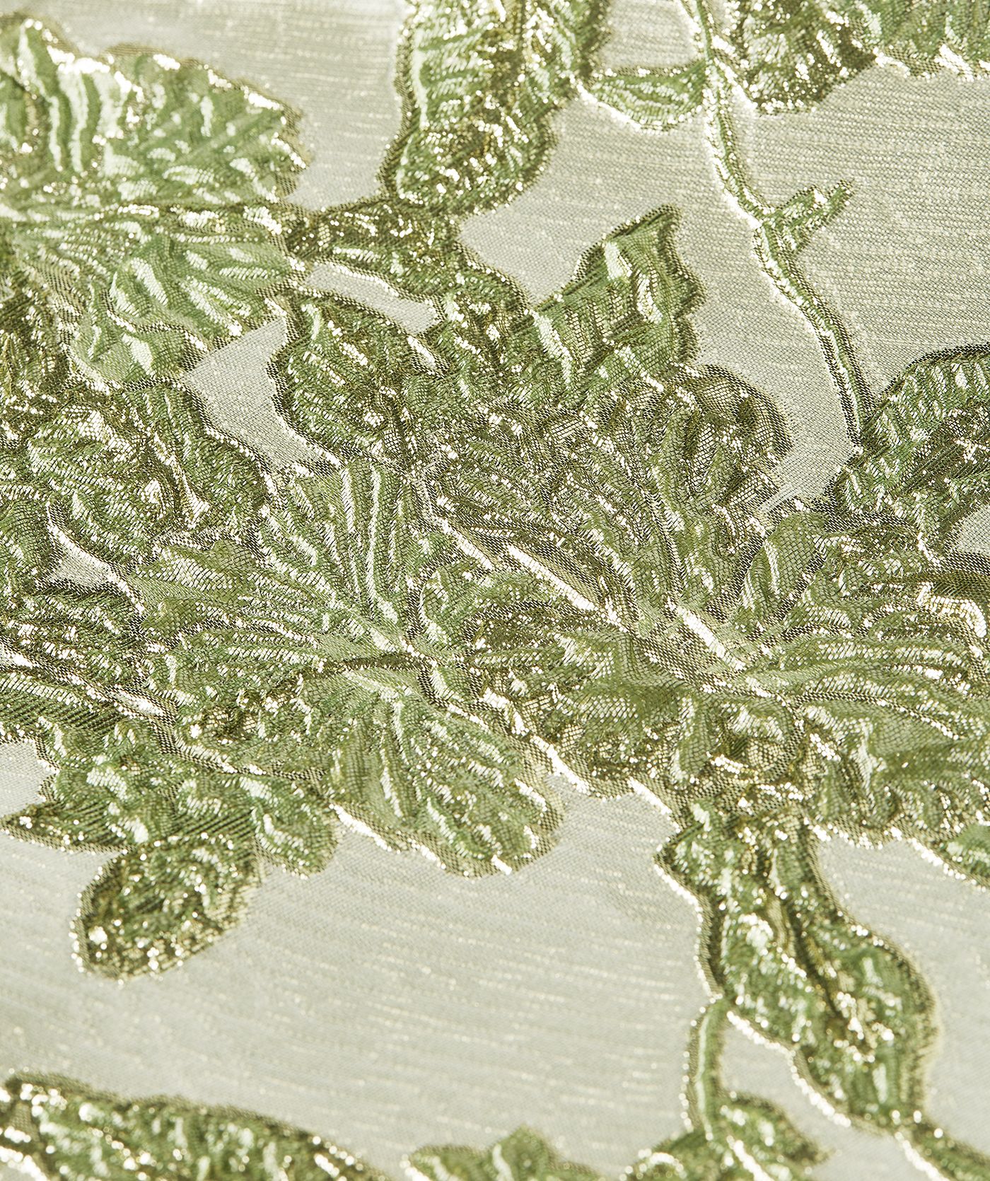 Close-up van een high waisted rok met metallic details in de kleur Dark Pistachio