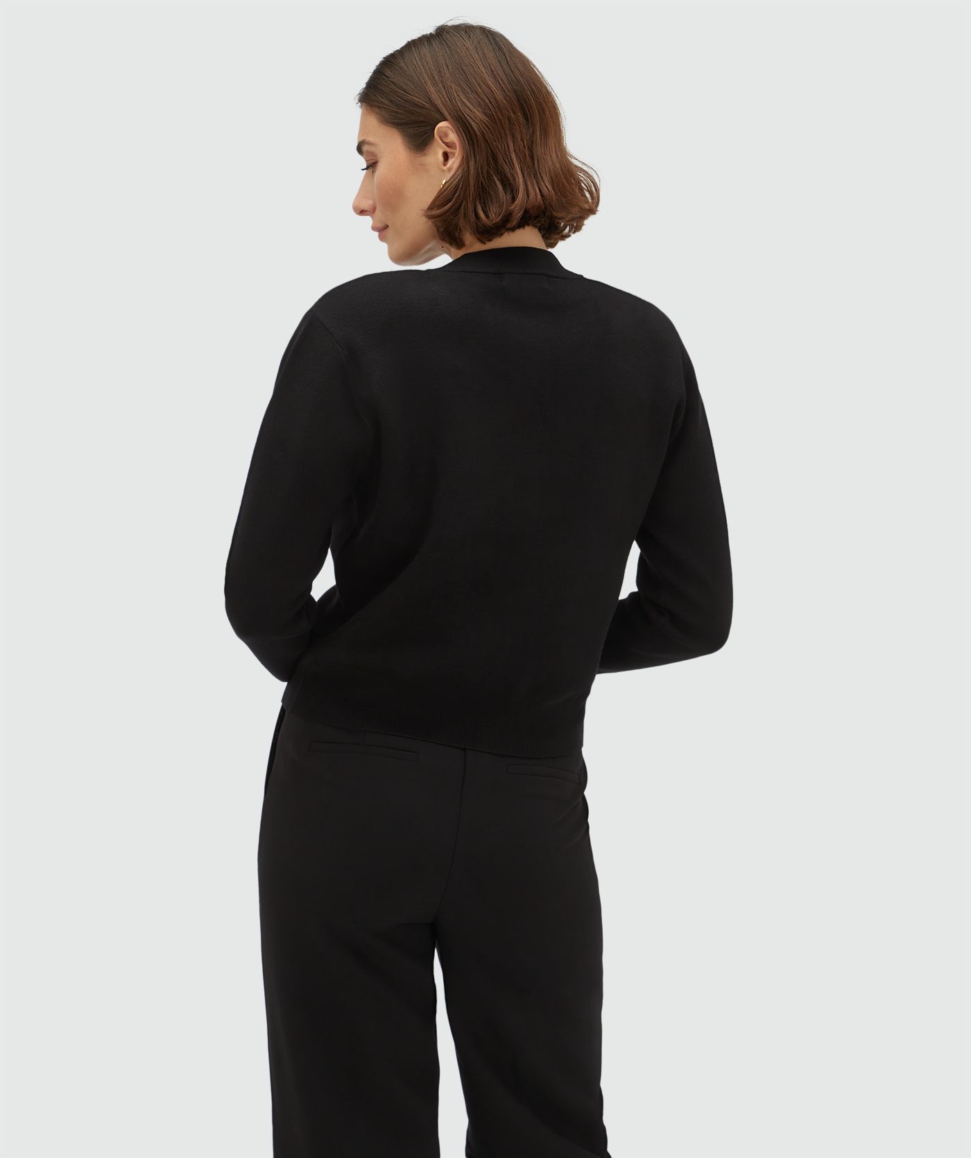 Achteraanzicht van een model in een regular fit vest