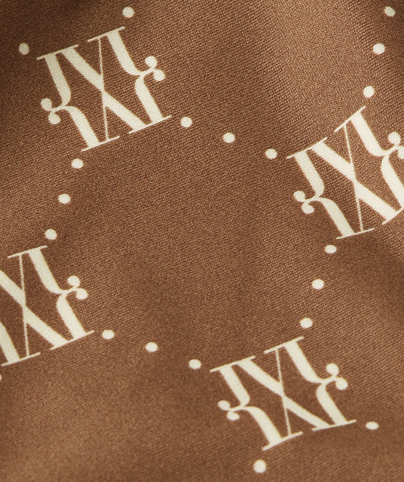 Close-up van een mid rise bikinibroekje in de kleur Brown Ecru