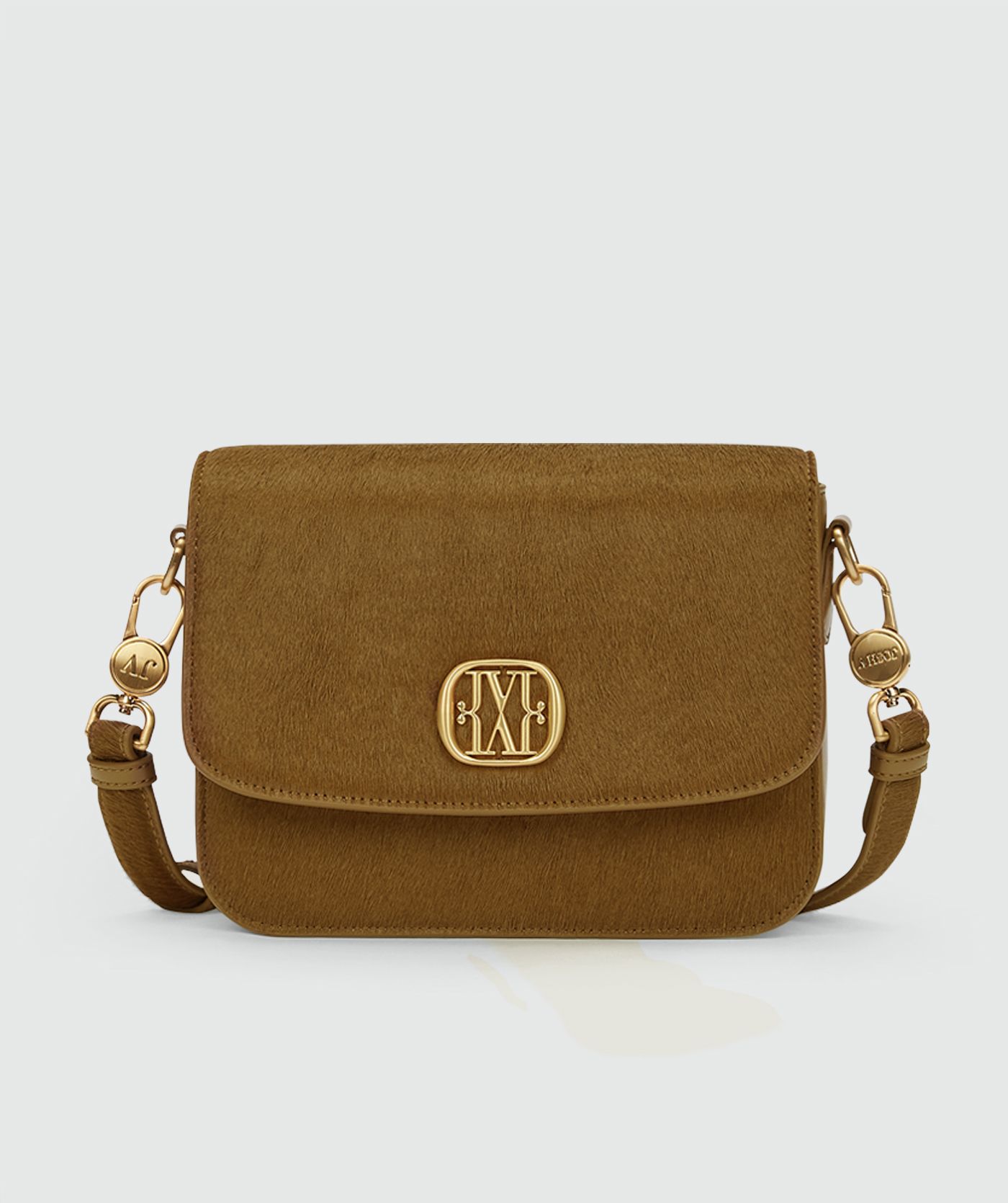 Tas met pony haar in de kleur Khaki zonder model, weergegeven op een lichtgrijze achtergrond.