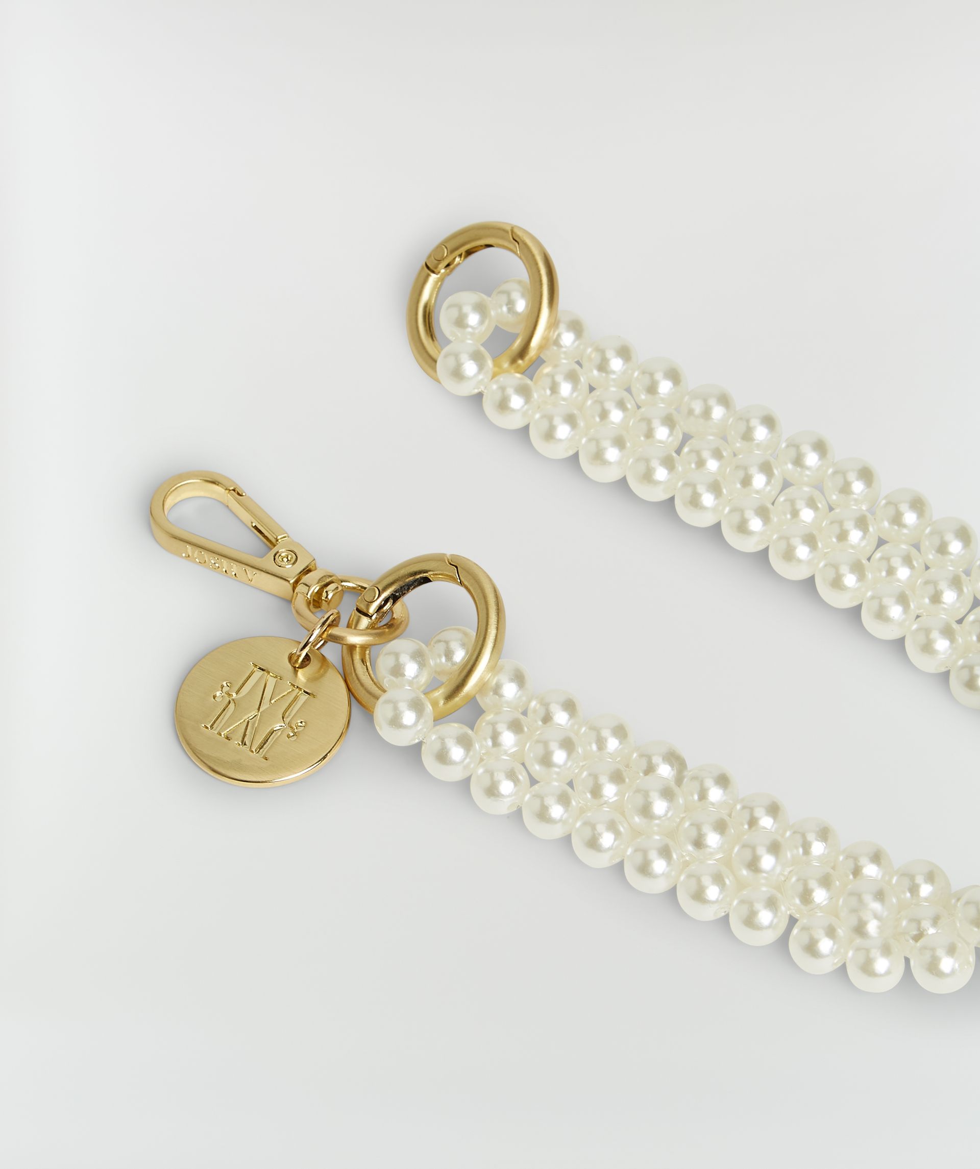 Close up van gouden details van de ketting.