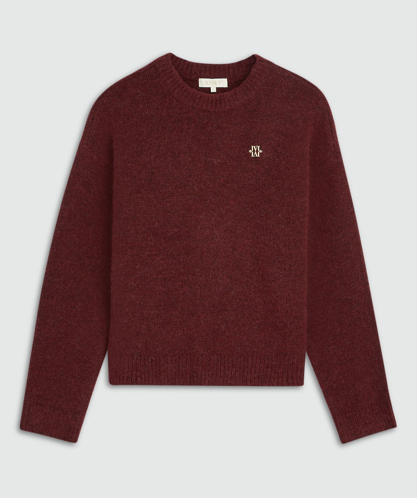 Donkerrode trui met een klein gouden JOSH V logo op de borst zonder model, weergegeven op een lichtgrijze achtergrond