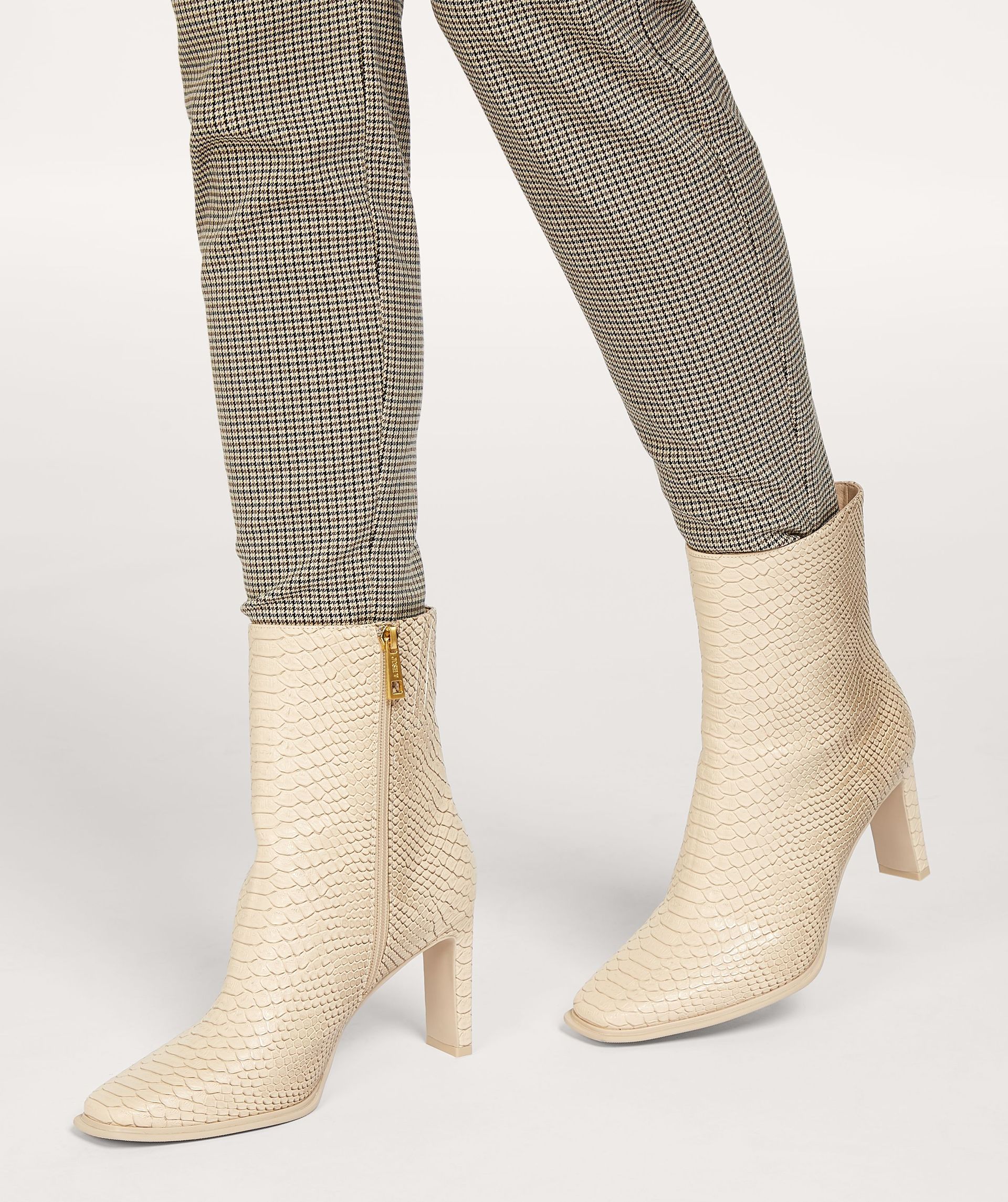 Snake print ankle boots top