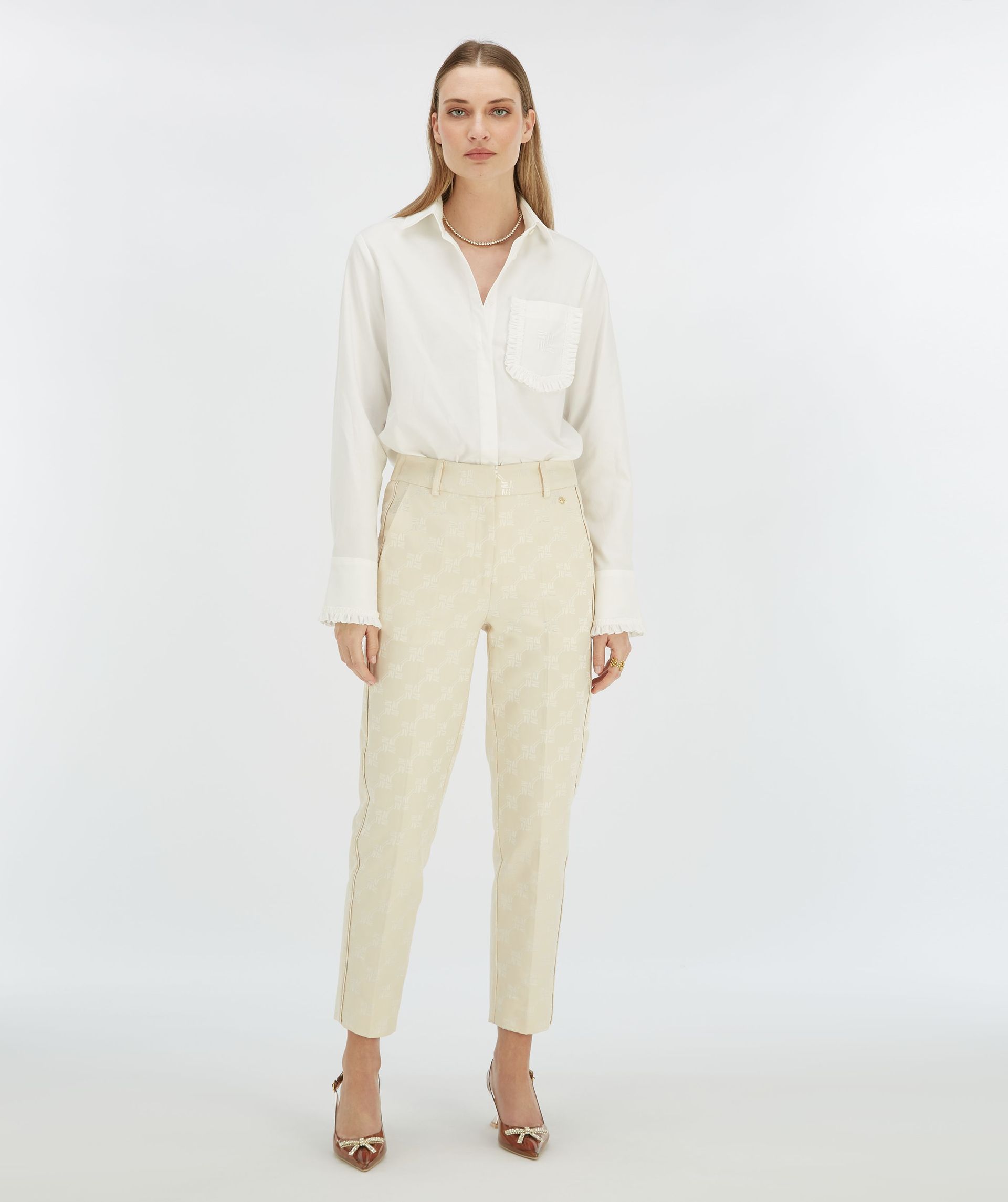 NIKITA slim fit trousers with logo print