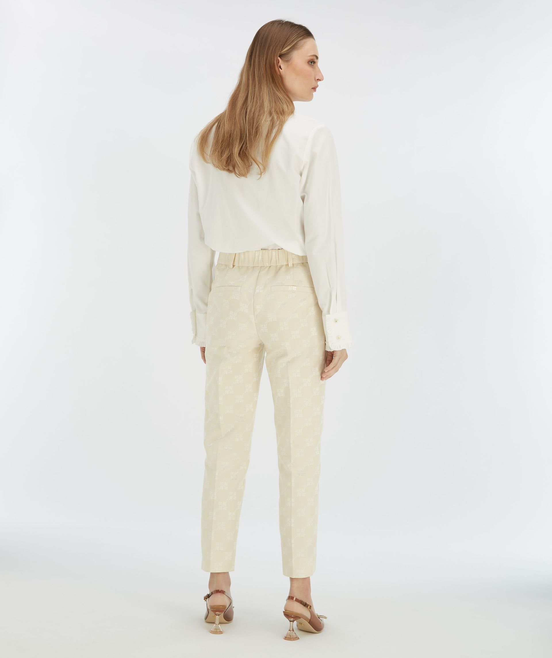 NIKITA slim fit trousers with logo print