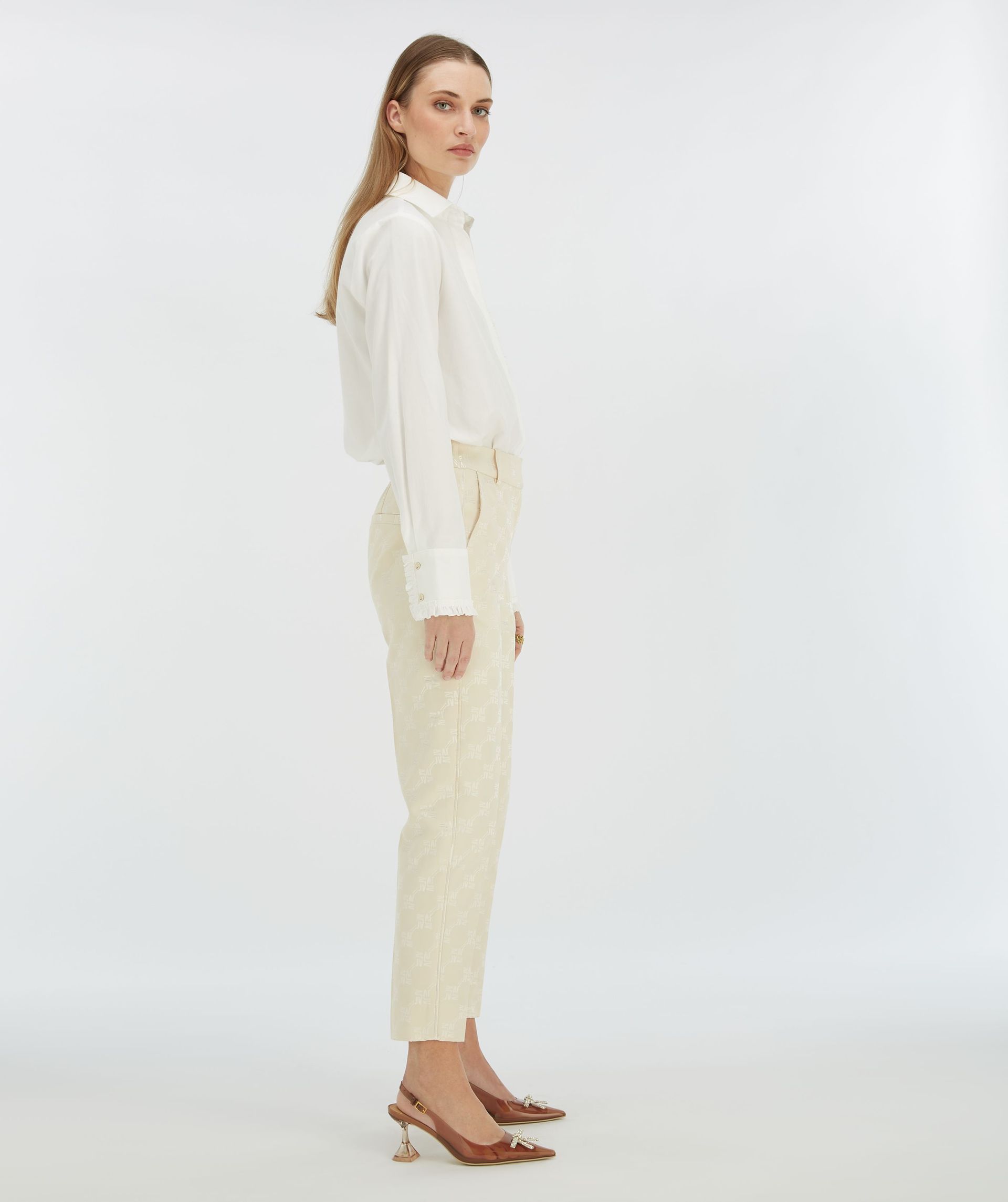 NIKITA slim fit trousers with logo print