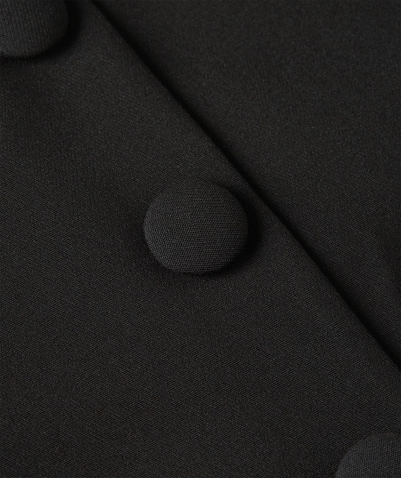 Close-up van zwarte knopen - JOSH V