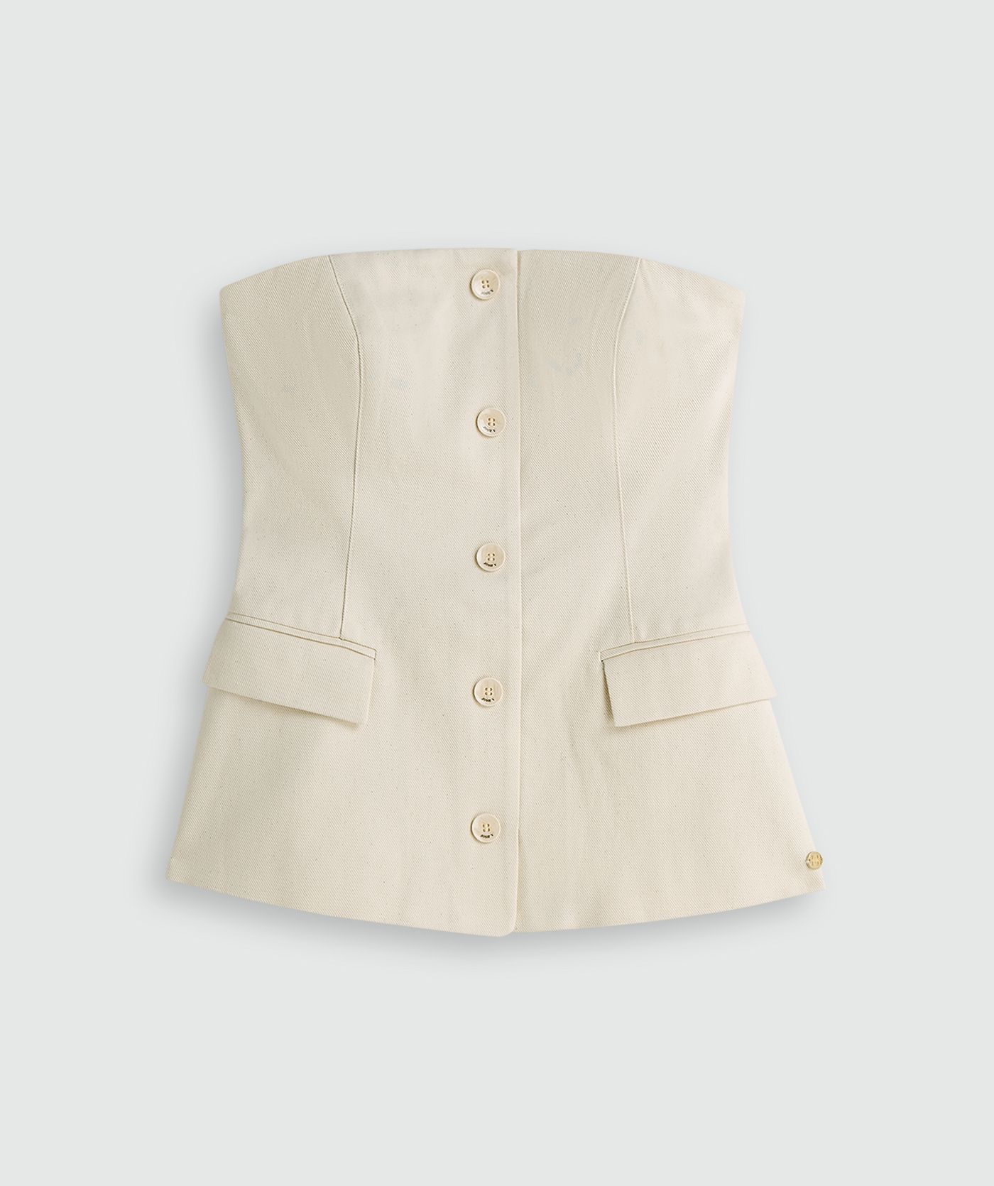 Gebroken witte bustier top met knopen aan de voorkant zonder model, weergegeven op een lichtgrijze achtergrond