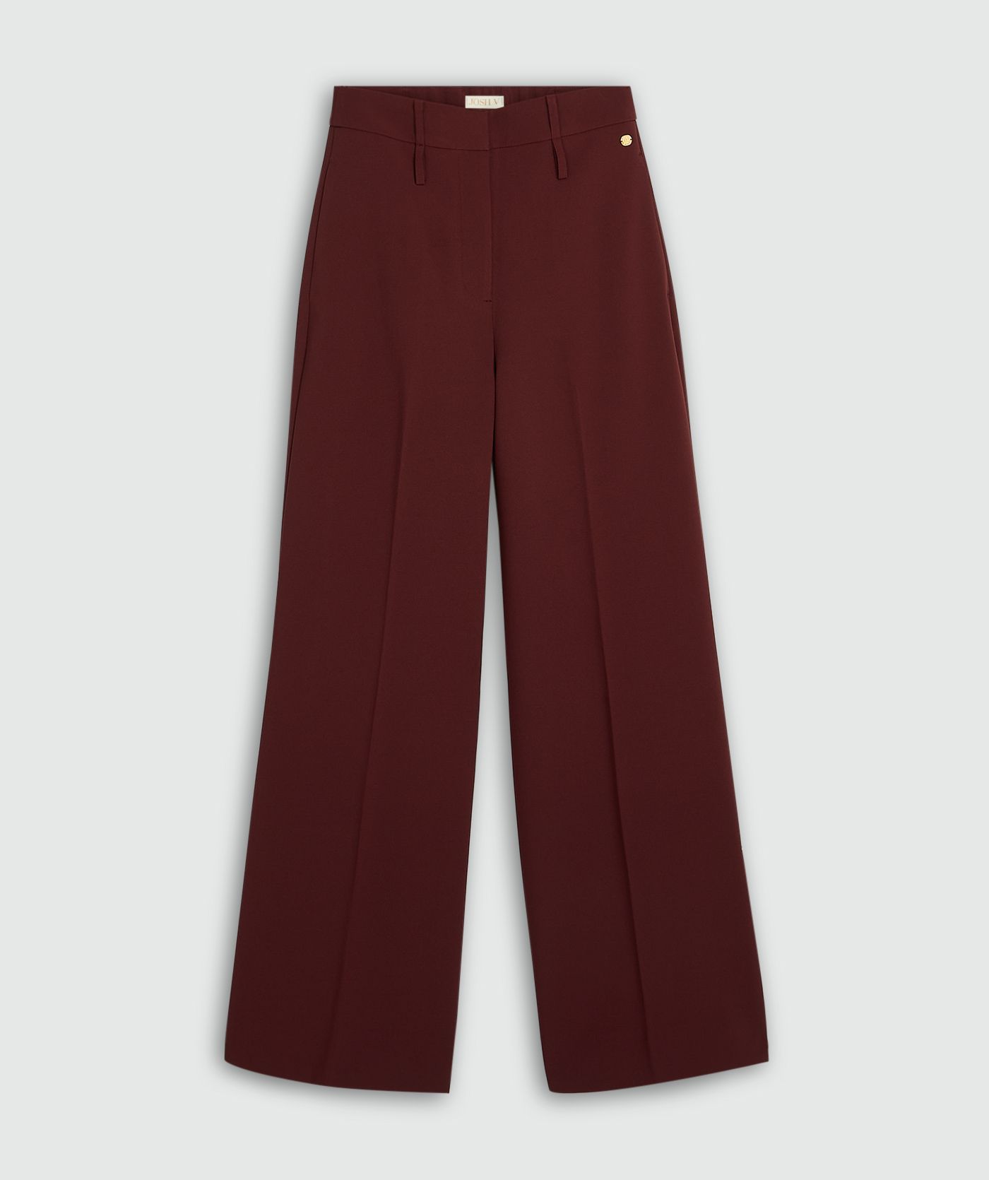 Donkerrode pantalon zonder model, weergegeven op een lichtgrijze achtergrond.
