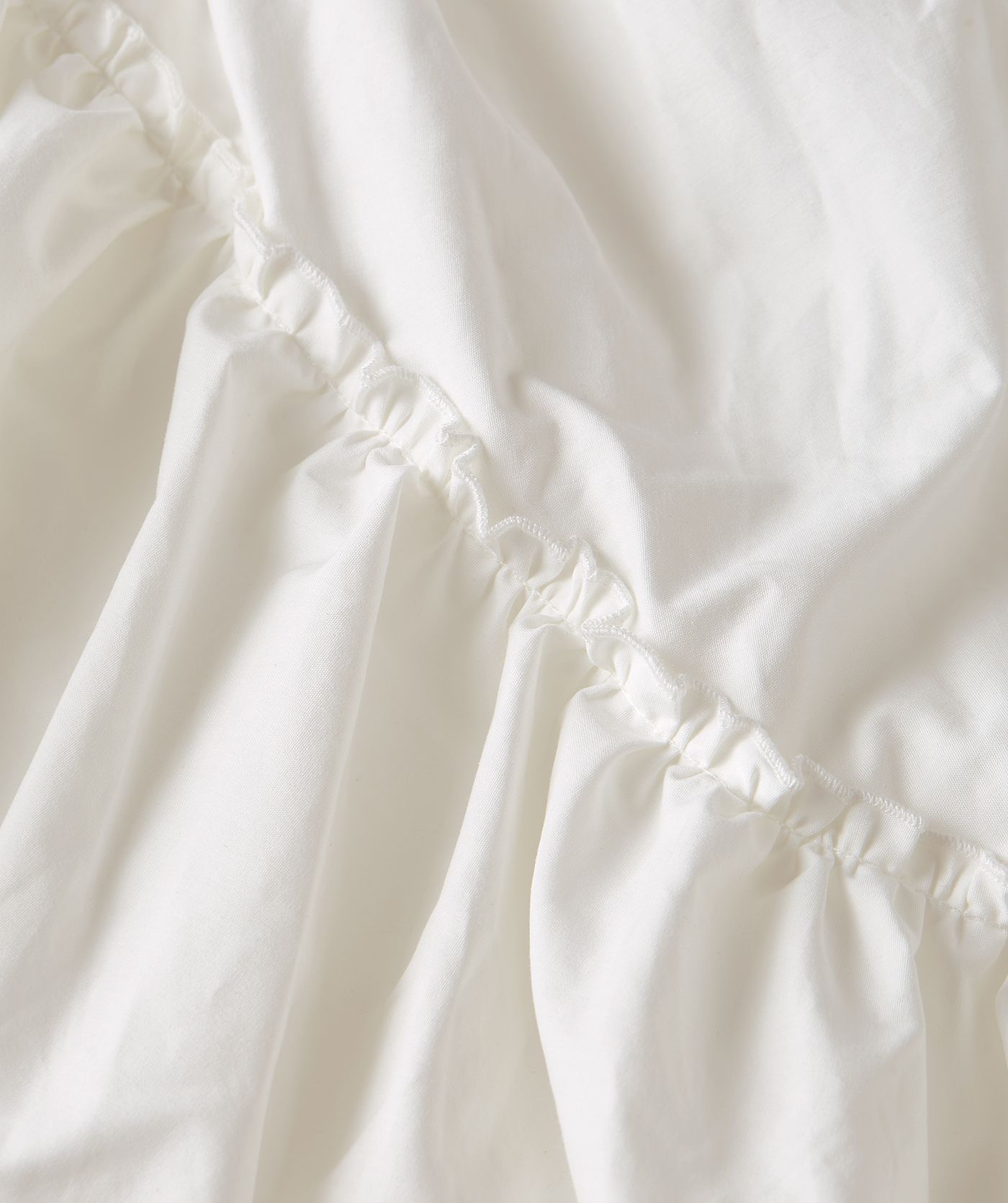 Close-up van een high waisted maxi rok in de kleur Off White