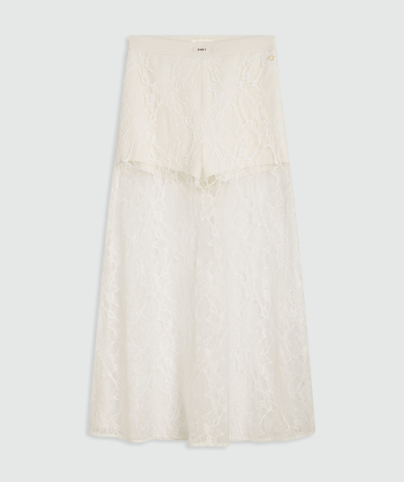 Een high waisted kanten rok in de kleur Crème Wit, met een jersey broekje eronder. In het midden van de elastische tailleband is het JOSH V-label zichtbaar, weergegeven tegen een lichtgrijze achtergrond