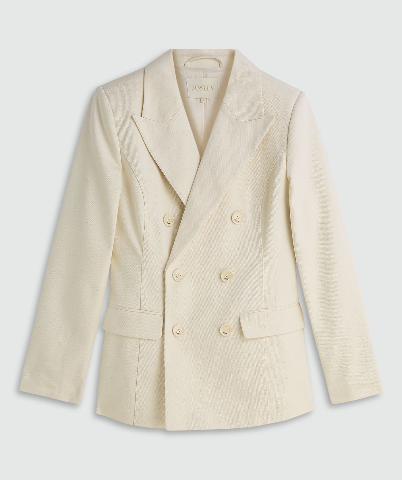 Crème blazer zonder model, weergegeven op een lichtgrijze achtergrond