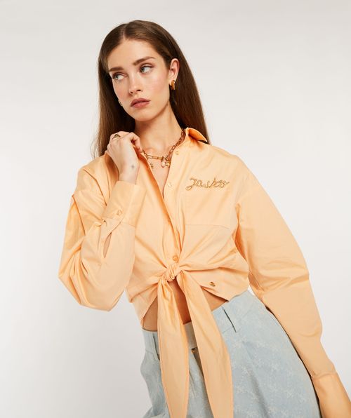 HILOU cropped oversized knotted blouse
